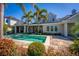 The backyard features a pristine pool and well-maintained landscaping creating a serene outdoor retreat at 1590 Harston Ave, Orlando, FL 32814