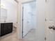 This bathroom features a modern vanity, sleek fixtures, and access to a walk-in closet at 15998 Sw 33Rd Avenue Rd, Ocala, FL 34473