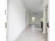 Inviting entryway with neutral tile flooring leading to a bright, open floor plan with natural light at 15998 Sw 33Rd Avenue Rd, Ocala, FL 34473