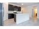 Open concept kitchen with an island, stainless appliances, and dark cabinets at 15998 Sw 33Rd Avenue Rd, Ocala, FL 34473