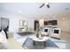 Open-concept living room, dining room, and kitchen area showcasing contemporary design and furnishings at 15998 Sw 33Rd Avenue Rd, Ocala, FL 34473