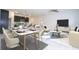 Open layout featuring the dining room, kitchen, and living room, creating an inclusive atmosphere at 15998 Sw 33Rd Avenue Rd, Ocala, FL 34473