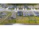 Beautiful aerial view of homes with solar panels on a large lot by the lake at 1631 Pontiff Pl, Davenport, FL 33896