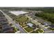 Panoramic aerial shot of community amenities, a swimming pool, and a playground amidst a picturesque neighborhood at 1631 Pontiff Pl, Davenport, FL 33896