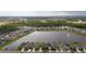 Expansive aerial view captures a large lakefront community surrounded by lush landscapes and amenities at 1631 Pontiff Pl, Davenport, FL 33896