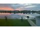 Enjoy the serene lake views and stunning sunset from this backyard oasis, complete with lush green lawn at 1631 Pontiff Pl, Davenport, FL 33896