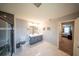 Bathroom features a double vanity, a sleek glass-enclosed shower, and marble-look flooring at 1631 Pontiff Pl, Davenport, FL 33896
