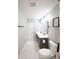Bathroom featuring tile floors, gray cabinets, and a double sink at 1631 Pontiff Pl, Davenport, FL 33896