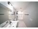 Bathroom featuring a single vanity and a shower-tub with a subway tile surround at 1631 Pontiff Pl, Davenport, FL 33896