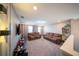 Upstairs bonus room featuring two sofas and a media center at 1631 Pontiff Pl, Davenport, FL 33896