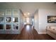 Hallway view features hard flooring, recessed lighting, and decorative mirrors along the wall at 1631 Pontiff Pl, Davenport, FL 33896