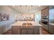 Open kitchen featuring a large island with a stainless steel sink, and pendant lighting at 1631 Pontiff Pl, Davenport, FL 33896