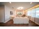 Bright living room with hardwood floors, large windows, and comfortable seating at 1631 Pontiff Pl, Davenport, FL 33896