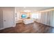 Bright living room featuring modern lighting, hardwood floors, and comfortable seating at 1631 Pontiff Pl, Davenport, FL 33896
