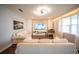 Bright living room with hardwood floors, large windows, and comfortable seating at 1631 Pontiff Pl, Davenport, FL 33896