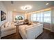 Bright living room featuring hardwood floors, large windows, and comfortable seating at 1631 Pontiff Pl, Davenport, FL 33896