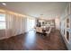 Open living space with dining area, modern light fixture, and view of the kitchen at 1631 Pontiff Pl, Davenport, FL 33896