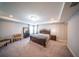 This main bedroom showcases a stylish tray ceiling, lots of light, and ample space at 1631 Pontiff Pl, Davenport, FL 33896