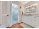 Modern bathroom with glass-enclosed shower, granite countertops, and white cabinets at 169 Mallard Ln, Daytona Beach, FL 32119