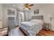 Comfortable bedroom featuring a ceiling fan, stylish decor, and hardwood floors at 169 Mallard Ln, Daytona Beach, FL 32119