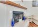 Cozy fireplace with tile surround and wood mantle at 169 Mallard Ln, Daytona Beach, FL 32119