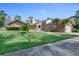 Charming brick home with well-manicured lawn and beautiful landscaping details at 169 Mallard Ln, Daytona Beach, FL 32119