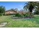 Landscaped front yard with lush grass and flowering plants at 169 Mallard Ln, Daytona Beach, FL 32119
