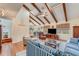 Bright living room with beamed ceilings, skylights, and hardwood floors throughout at 169 Mallard Ln, Daytona Beach, FL 32119