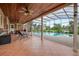 Outdoor covered patio leading to a screened-in pool overlooking the backyard at 169 Mallard Ln, Daytona Beach, FL 32119
