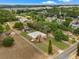 Aerial view of the property and neighborhood, showcasing its setting and landscaping at 2002 Adair St, Ocoee, FL 34761