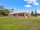 Expansive backyard featuring a large, screened lanai perfect for entertaining at 2002 Adair St, Ocoee, FL 34761