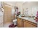 Bathroom with shower, granite vanity, and decorative accents at 2002 Adair St, Ocoee, FL 34761