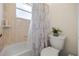 Bathroom featuring a tub and shower combination and neutral color palette at 2002 Adair St, Ocoee, FL 34761