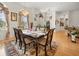 Well-lit dining room featuring a chandelier, a table with seating for six, and natural light at 2002 Adair St, Ocoee, FL 34761