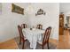 Cozy dining room with classic wood furniture, neutral decor, hardwood floors, and natural light at 2002 Adair St, Ocoee, FL 34761