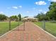 Long private driveway leading to a ranch-style home with lush front lawn at 2002 Adair St, Ocoee, FL 34761