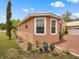 Exterior of home with manicured landscaping and brick pathway at 2002 Adair St, Ocoee, FL 34761