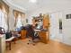 View of home office with hardwood flooring, large desk, and access to closet at 2002 Adair St, Ocoee, FL 34761