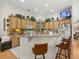 Bright kitchen features custom cabinets, granite countertops, a breakfast bar, and views into the adjacent dining area at 2002 Adair St, Ocoee, FL 34761