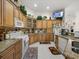 Well-appointed kitchen with stainless appliances, granite countertops, custom cabinets, and tile flooring at 2002 Adair St, Ocoee, FL 34761