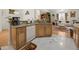 Kitchen bar overlooking a living room with hardwood floors, an area rug, and a large window at 2002 Adair St, Ocoee, FL 34761