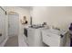 Functional laundry room with modern appliances and utility sink at 2002 Adair St, Ocoee, FL 34761