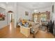 Bright living room with a ceiling fan, neutral walls and floors, and doorway leading to another room at 2002 Adair St, Ocoee, FL 34761