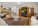 Open-concept floor plan features a living room adjacent to a kitchen with modern appliances and breakfast bar seating at 2002 Adair St, Ocoee, FL 34761