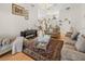 An inviting living area featuring a ceiling fan, a glass coffee table and a piano at 2002 Adair St, Ocoee, FL 34761