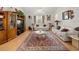 Inviting living room with plush seating, a patterned rug, hardwood floors, and a large entertainment center at 2002 Adair St, Ocoee, FL 34761