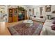 Inviting living room with plush couches, hardwood floors, a patterned rug, and large windows for natural light at 2002 Adair St, Ocoee, FL 34761
