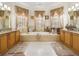 The main bathroom features double sinks, a bathtub, and plenty of natural light at 2002 Adair St, Ocoee, FL 34761