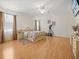 Spacious main bedroom with a ceiling fan, a TV, neutral walls, and large windows at 2002 Adair St, Ocoee, FL 34761