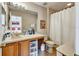 Neutral bathroom offering a single sink vanity, good storage, toilet and tiled floors at 202 Napoli Dr # 202, Davenport, FL 33897